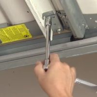 diy-garage-door-maintenance-tips-1-tighten-bolts